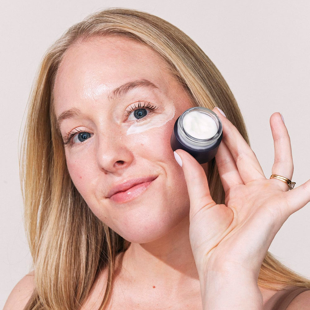 Eight Saints Retinol Eye Cream being applied with fingertips illustrating quick-absorbing texture