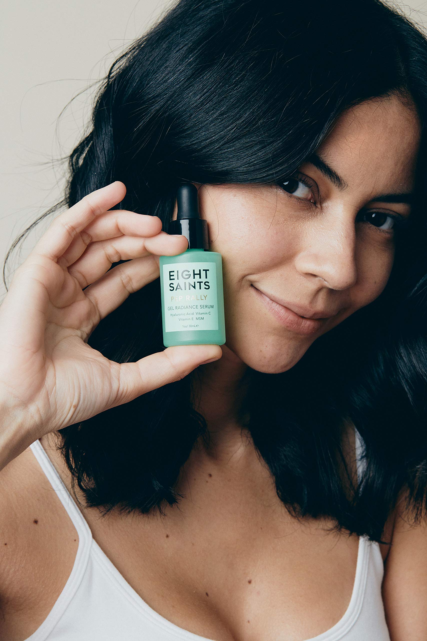 Eight Saints serum face-application demonstrating smooth, even skin after use.