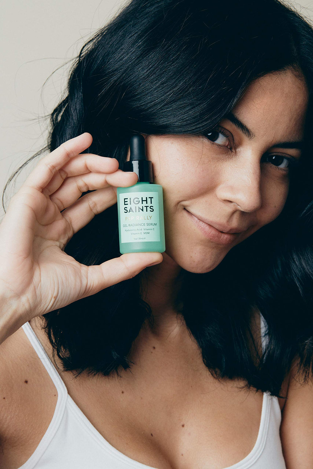 Eight Saints serum face-application demonstrating smooth, even skin after use.