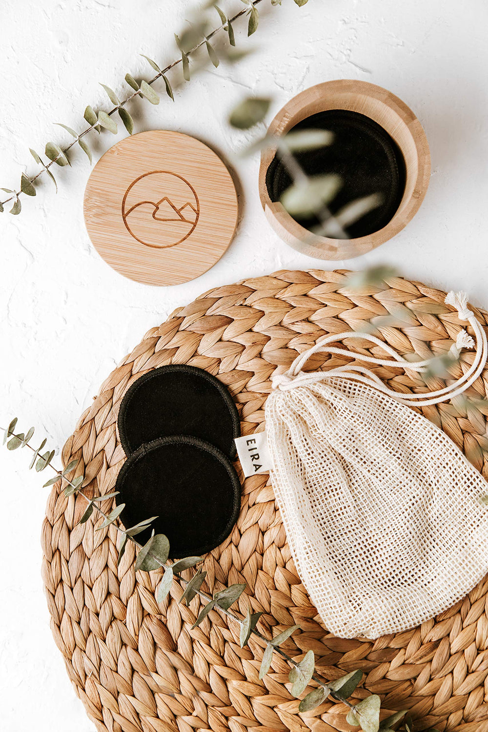 Eira Vancouver close-up of soft black cotton rounds highlighting skin-friendly texture.