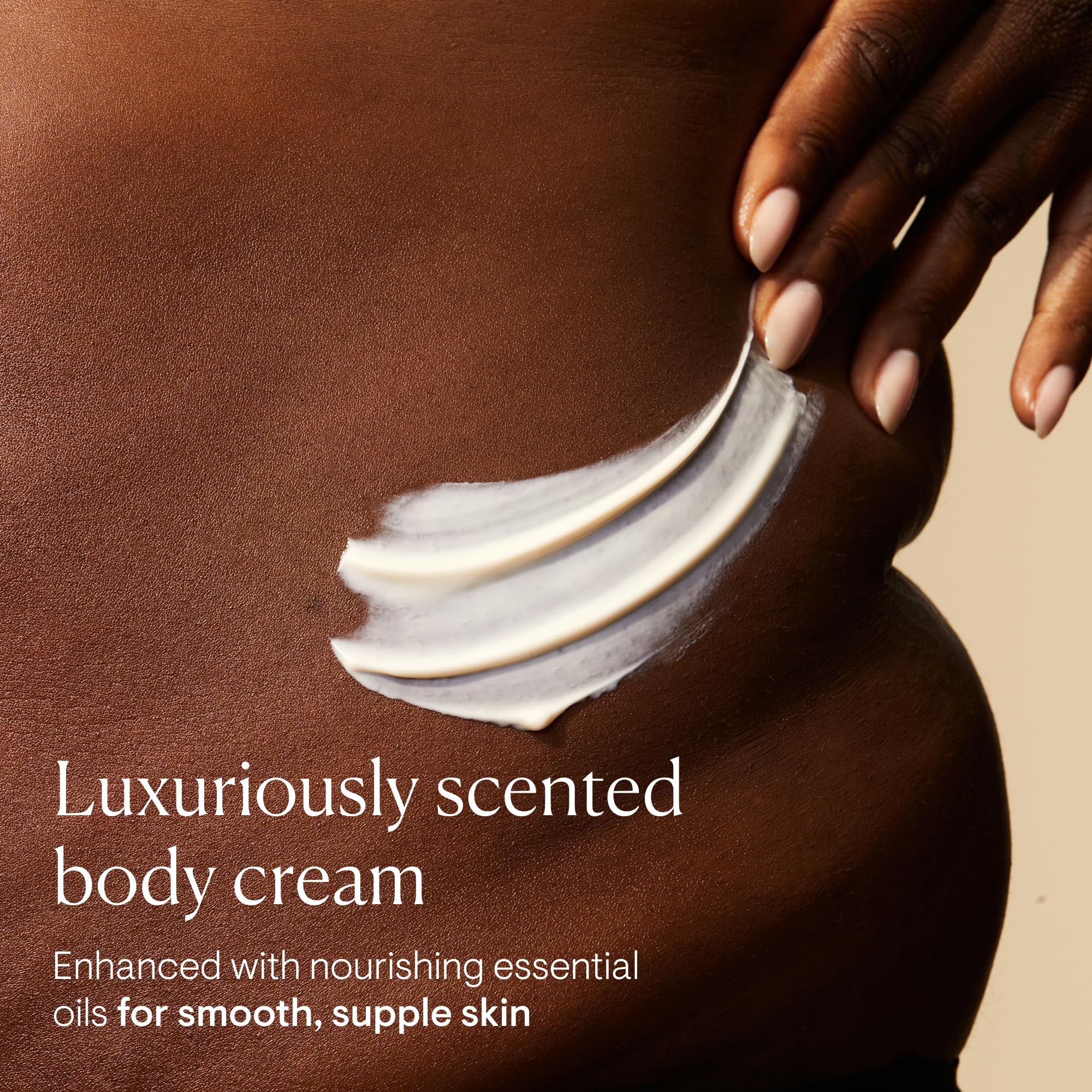 Elemis Frangipani Monoi Body Cream texture close-up highlights rich, creamy consistency.