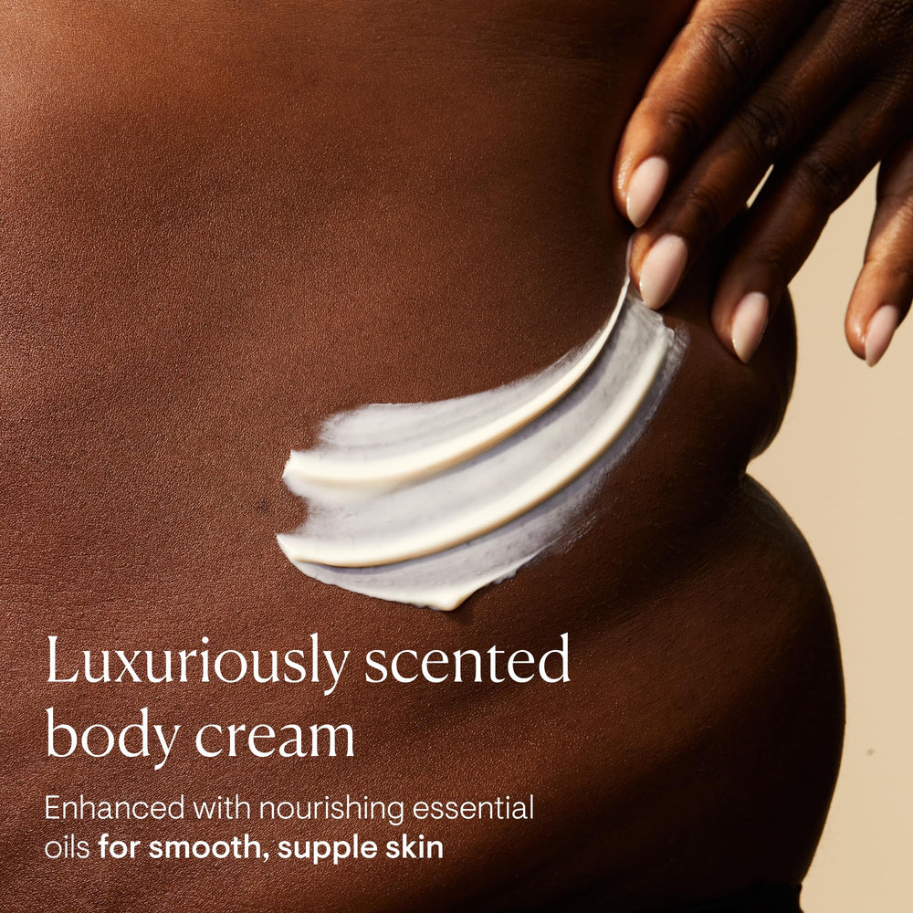Elemis Frangipani Monoi Body Cream texture close-up highlights rich, creamy consistency.