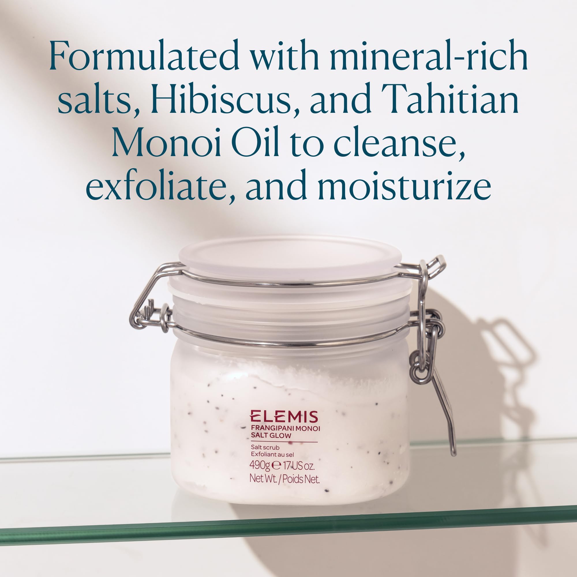 Elemis Frangipani Monoi Salt Glow foaming application demonstrates gentle exfoliation.
