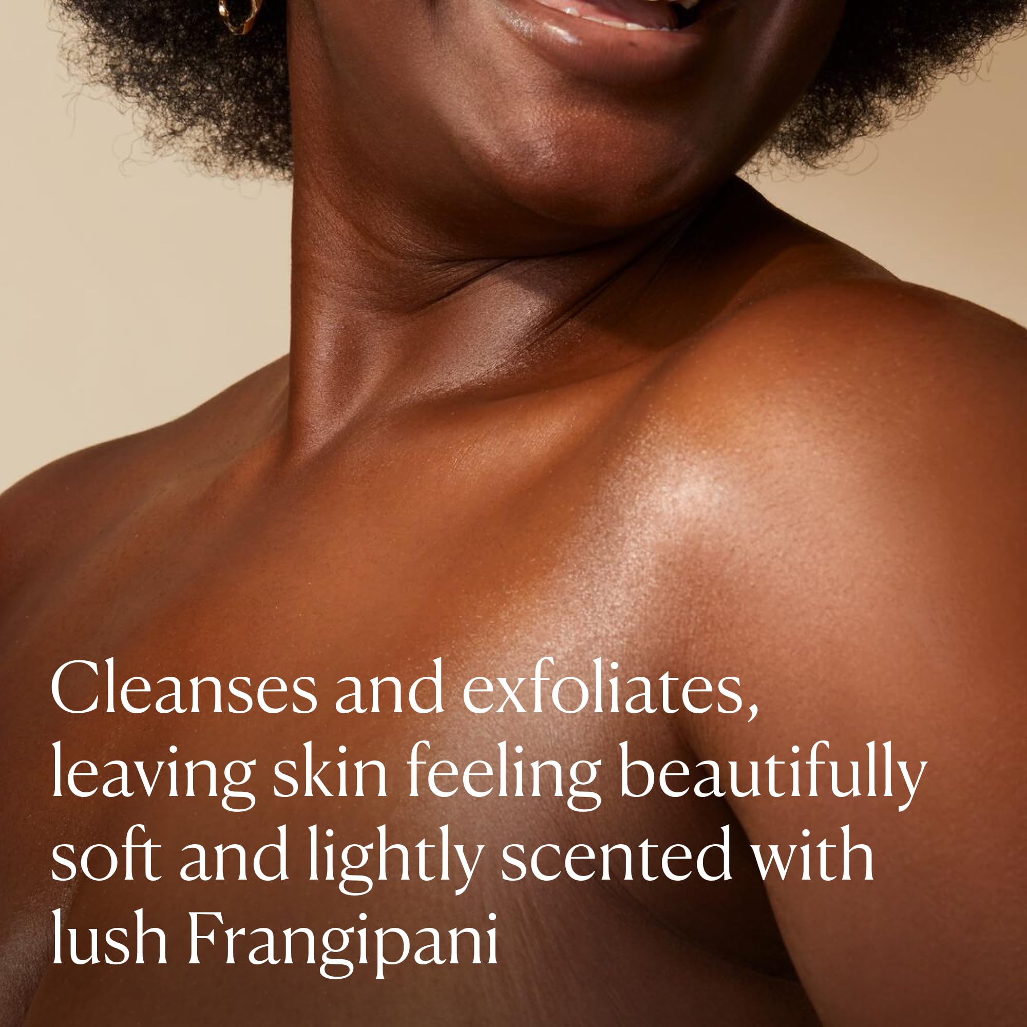 Elemis Frangipani Monoi Salt Glow jar close-up shows creamy scrub texture.