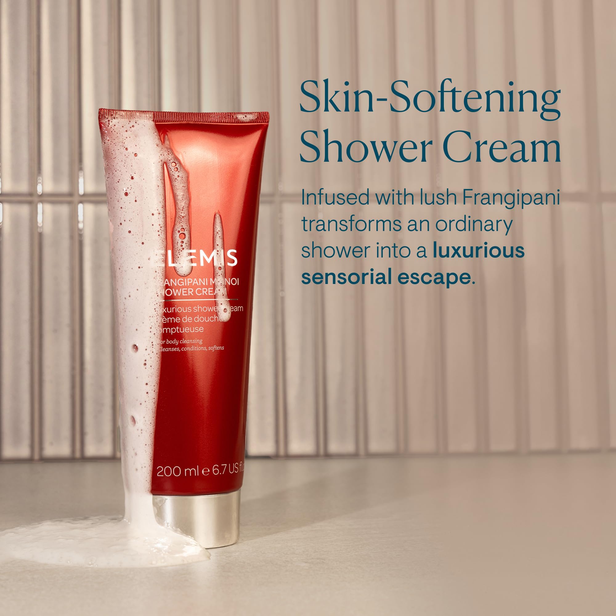 Elemis Frangipani Monoi shower cream application scene promotes spa-like routine.