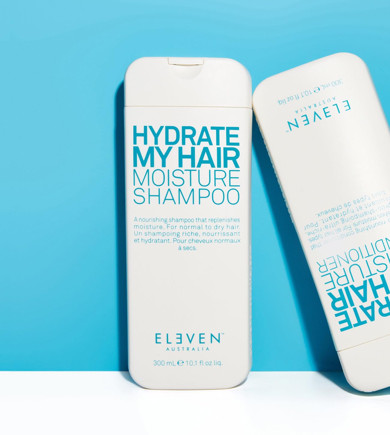 ELEVEN AUSTRALIA Hydrate My Hair packaging highlights 32.5 oz bottle for long-lasting use.