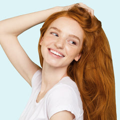 Elizabeth Mott Thank Me Later shine shot highlighting glossy, frizz-free results.