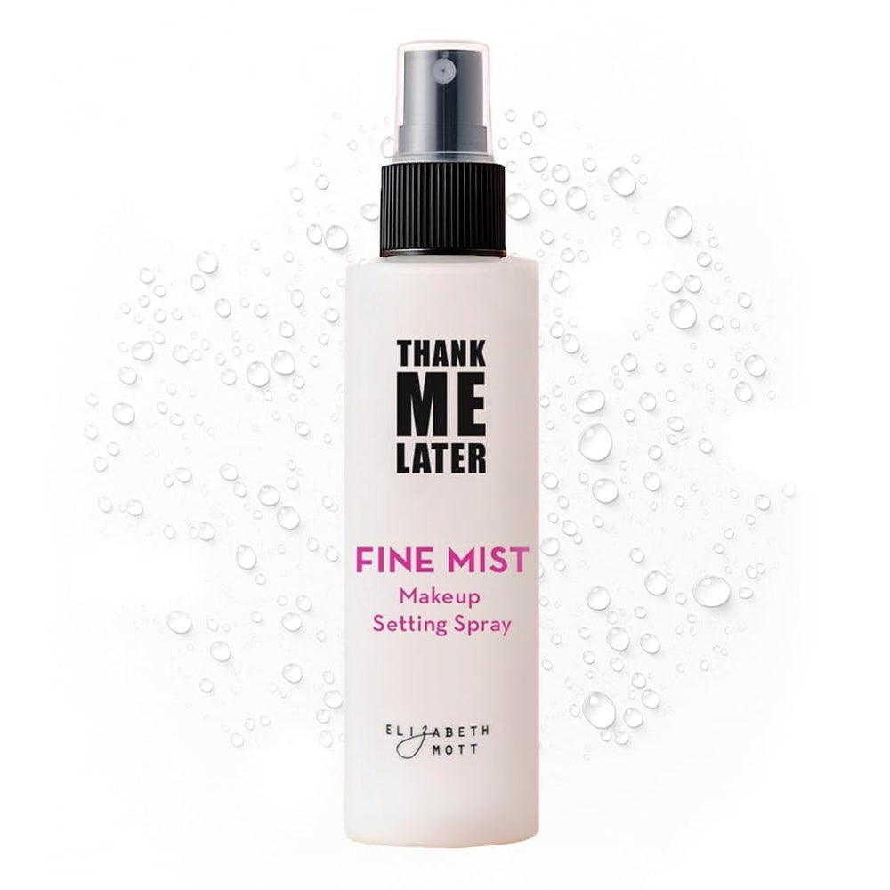 Elizabeth Mott Thank Me Later setting spray being misted for long-lasting wear and glow.