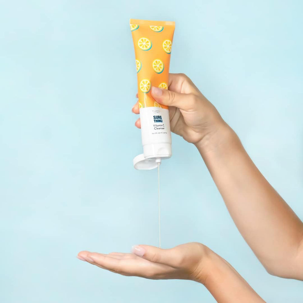 Elizabeth Mott Vitamin C Facial Cleanser applying a pea-sized amount shows easy massage and makeup removal
