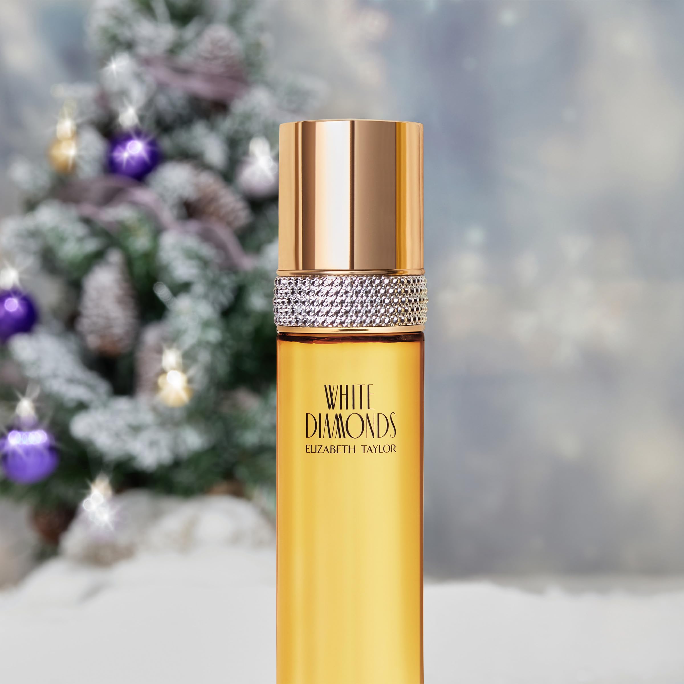 Elizabeth Taylor White Diamonds spray bottle capturing floral notes during application.