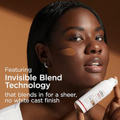 Applying EltaMD UV Clear Deep Tint sunscreen on hand for even coverage demonstration