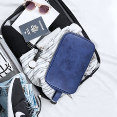 Elviros Toiletry Bag water-resistant material highlights moisture protection during trips.