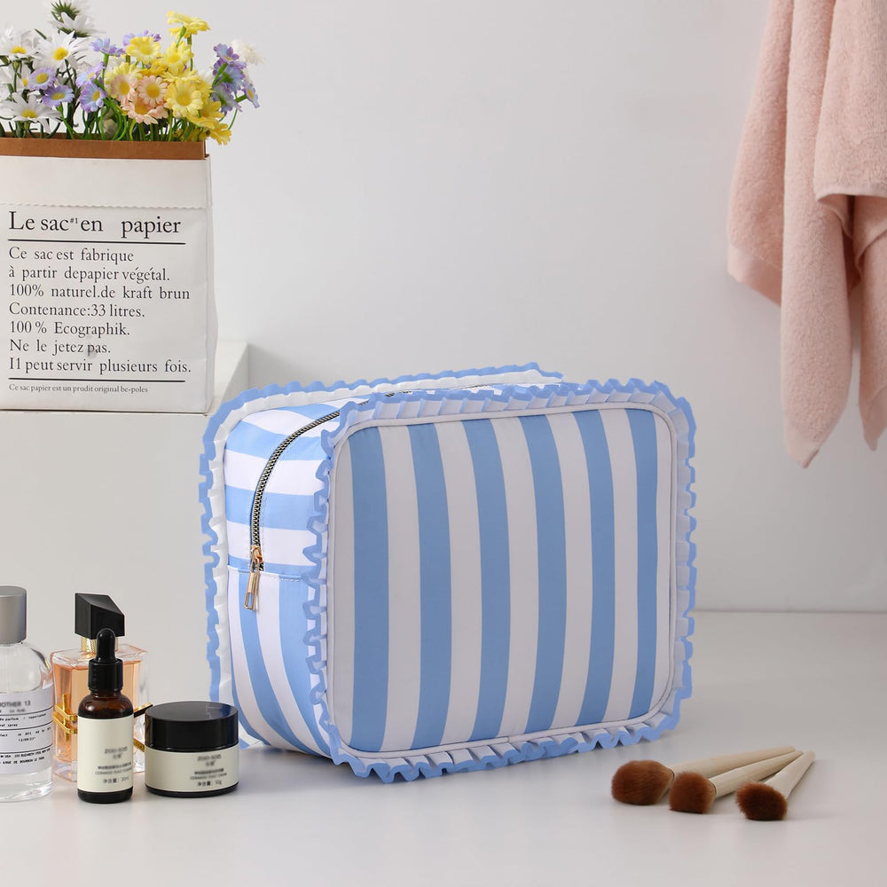 EMBRUNIOICE Stripe Ruffle Makeup Bag side view shows roominess for full-sized cosmetics.