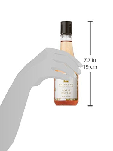 Hands massaging Eminence Apricot Body Oil into skin for nourishment.