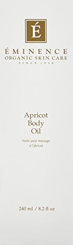 Pouring Eminence Apricot Body Oil for quick moisture boost.