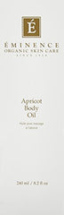 Pouring Eminence Apricot Body Oil for quick moisture boost.
