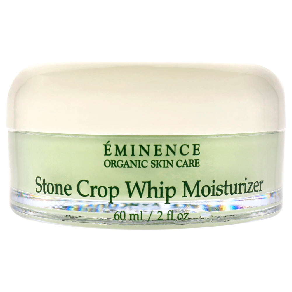 Eminence Stone Crop Whip Moisturizer being applied to skin in smoothing motion.