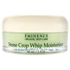 Eminence Stone Crop Whip Moisturizer being applied to skin in smoothing motion.