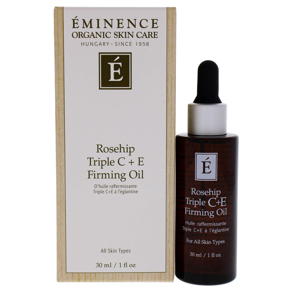 Eminence Rosehip Triple C+E Firming Oil bottle on vanity delivering deep hydration for mature skin.