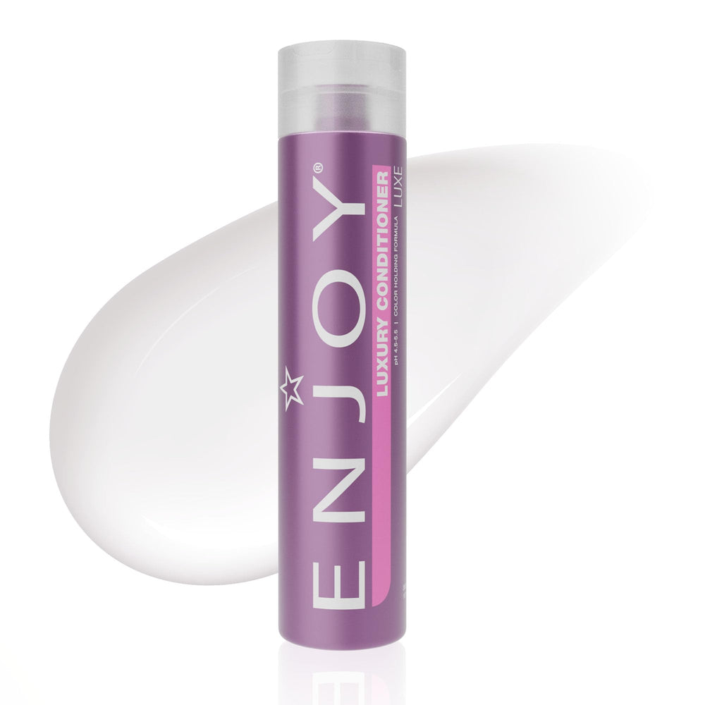 Enjoy Luxury Conditioner bottle pour shows frizz control and smooth hair texture.
