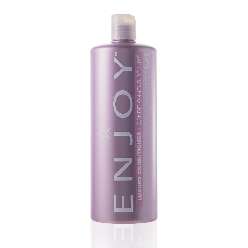 Enjoy Luxury Conditioner bottle showing frizz control for smoother hair.
