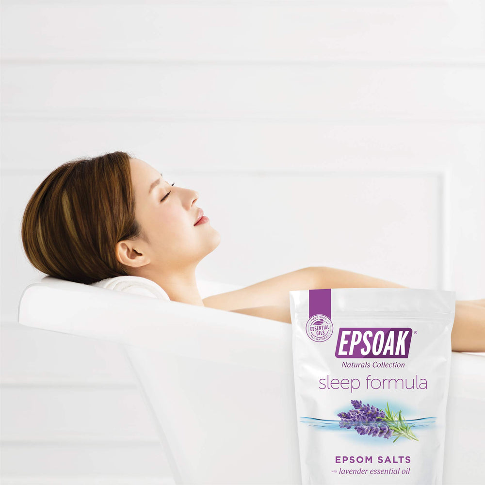 Epsoak Lavender Sleep Formula bath scene showing relaxing tub setup.