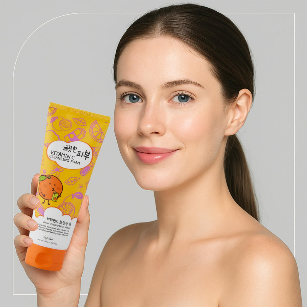 Esfolio Vitamin C Cleansing Foam applied to skin for balanced cleansing and refreshment.