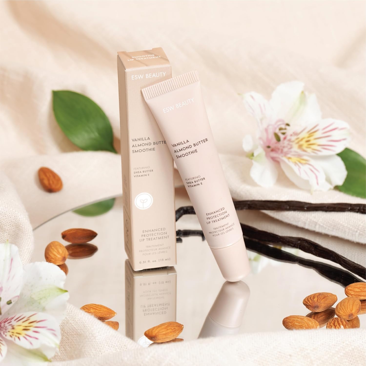 ESW Beauty Vanilla Almond Butter Lip Treatment shows subtle caramel-brown tint on skin.