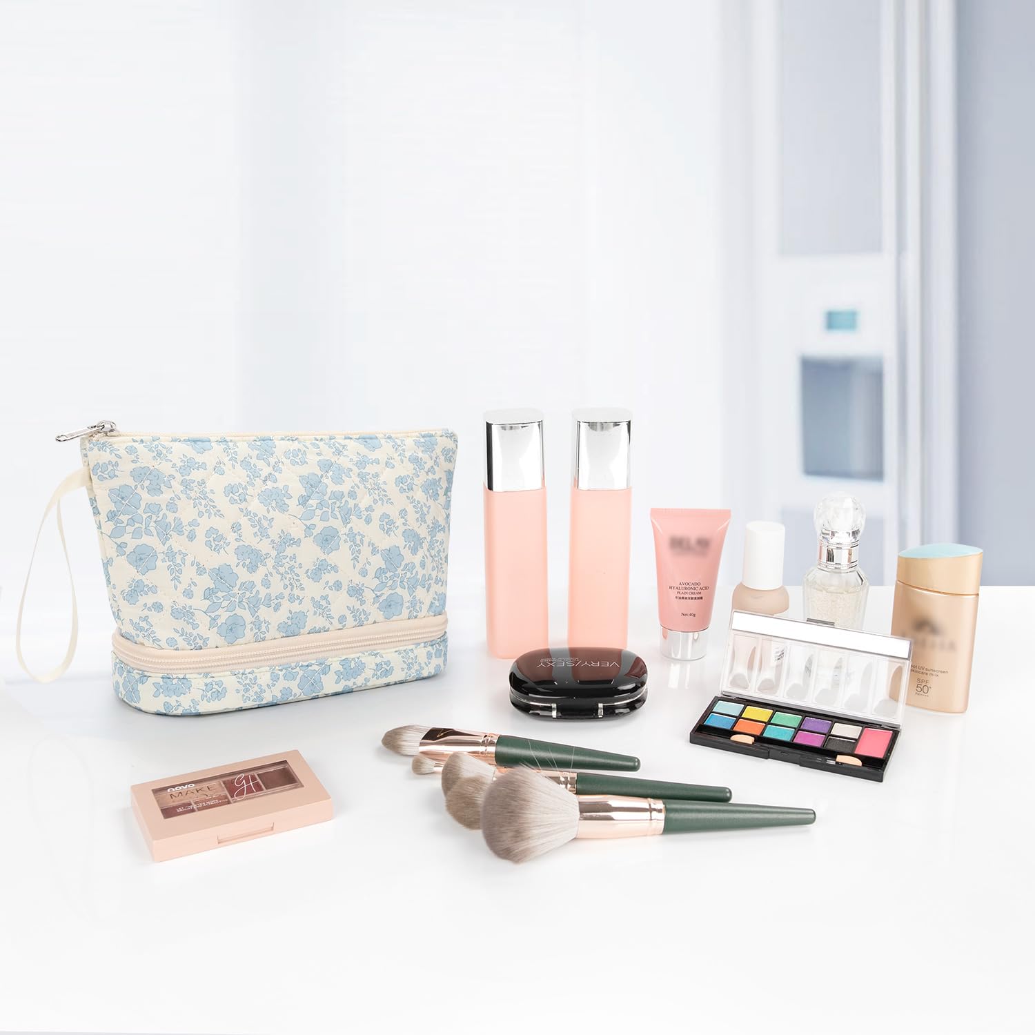 Ethereal small makeup bag blue flower design adds style to travel routines.