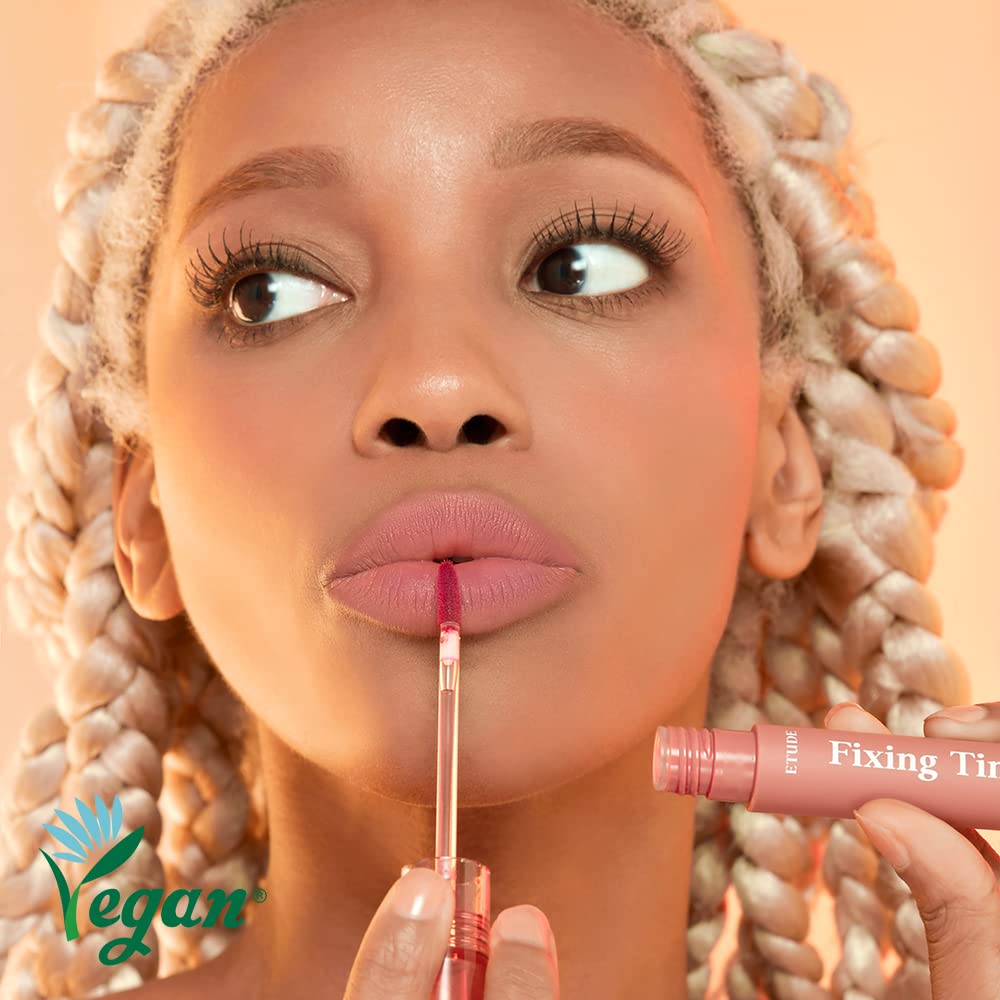 ETUDE Fixing Tint wand close-up shows precise lip color application.