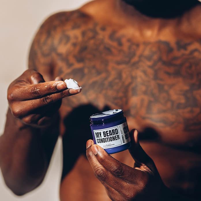 Evan Alexander Grooming beard conditioner texture closeup shows smoothing application.