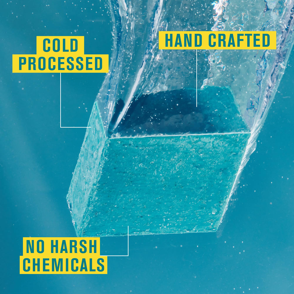 Every Man Jack Cold Plunge bar close-up highlights medium grit for exfoliation.