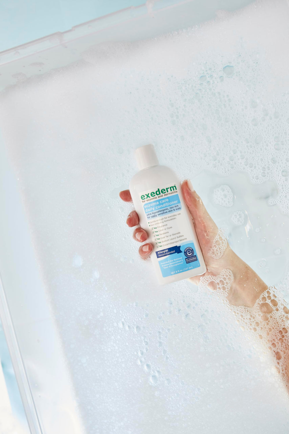 Exederm conditioner on soft hair after use for manageable, smooth strands.
