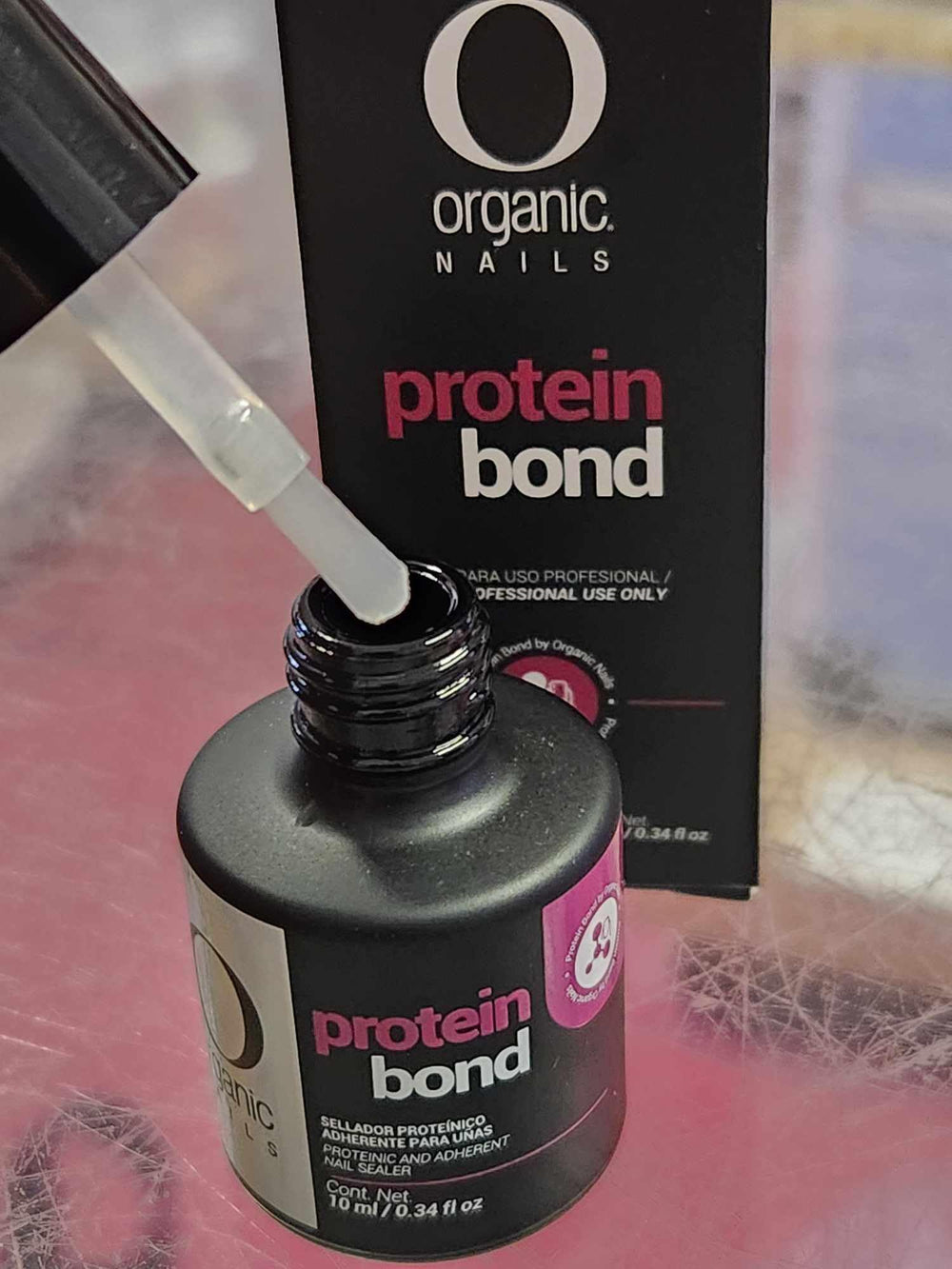 Extravaganza Nails Protein Bond Primer open cap enables precise application.