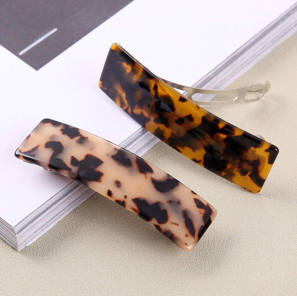 Eyegla barrette with automatic spring-closure delivers quick styling and reliable grip.
