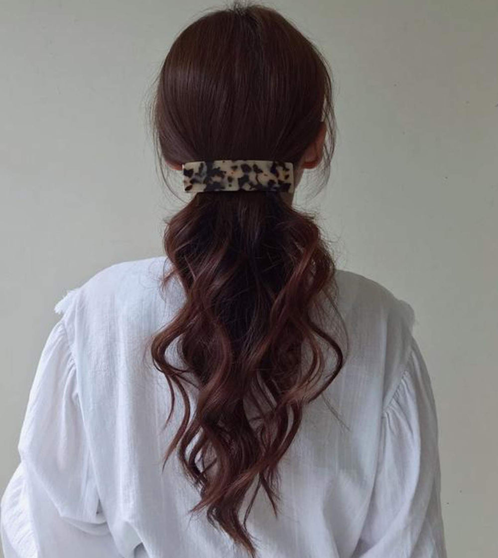 Eyegla celluloid rectangle barrette side twist highlights versatile styling options.