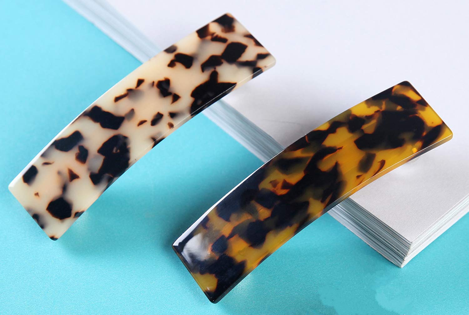 Eyegla tortoise-shell barrette worn with a chic outfit for daily elegance.