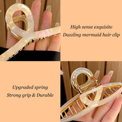 FAELBATY clip close-up showing sturdy metal spring and acetate finish