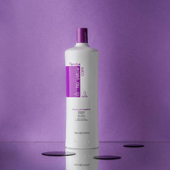 Fanola No Yellow Shampoo being poured demonstrates violet pigment neutralizing yellow tones