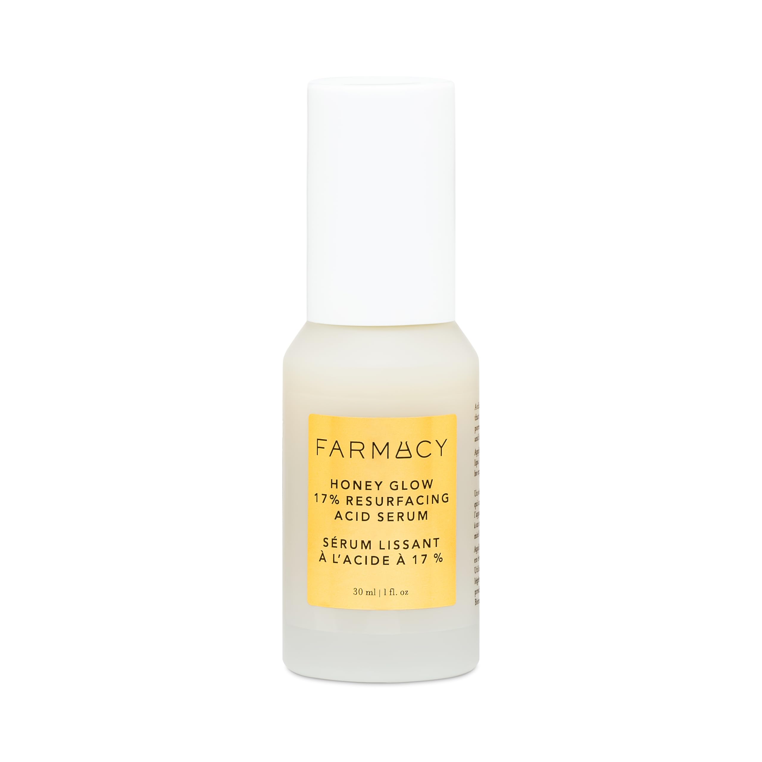 Farmacy Honey Glow Serum bottle closeup showcases glow-boosting hydration for nighttime skincare.