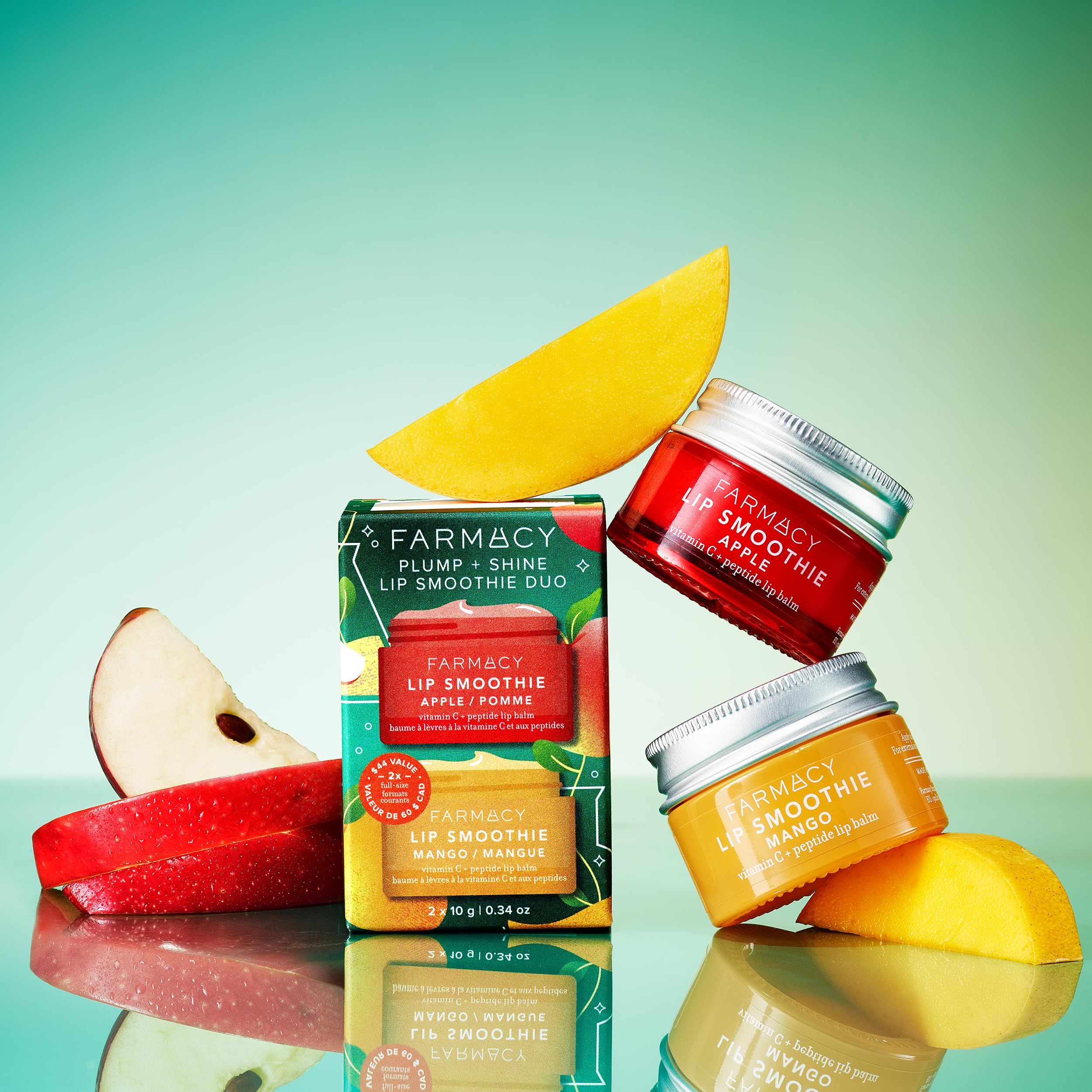 Farmacy Lip Smoothie Mango balm tube close-up—glossy finish on lips.