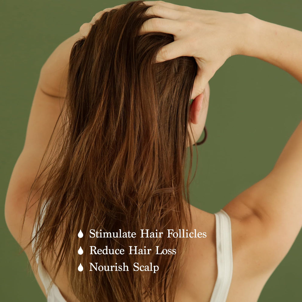 FEIBTH Natural Hair Growth Oil drops demonstrate easy scalp application for daily care.