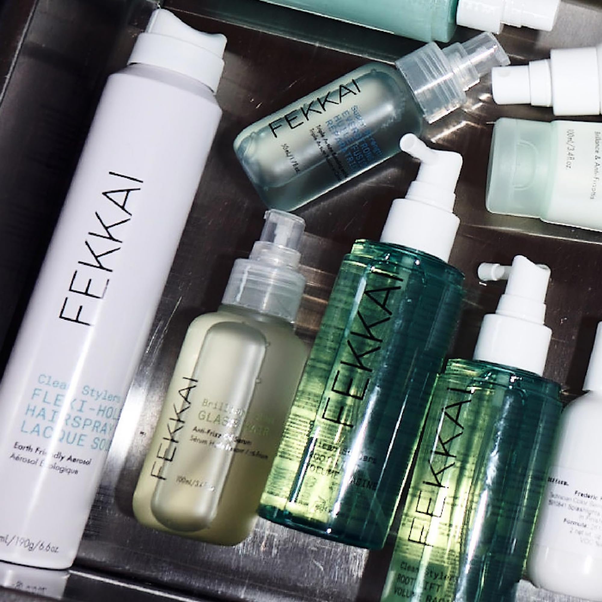 Fekkai Brilliant Gloss Glass bottle with dropper highlights 450°F heat protection.
