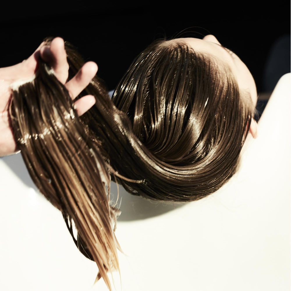 Fekkai Brilliant Gloss Multi-Tasker cream texture delivers smooth, frizz-free hair.