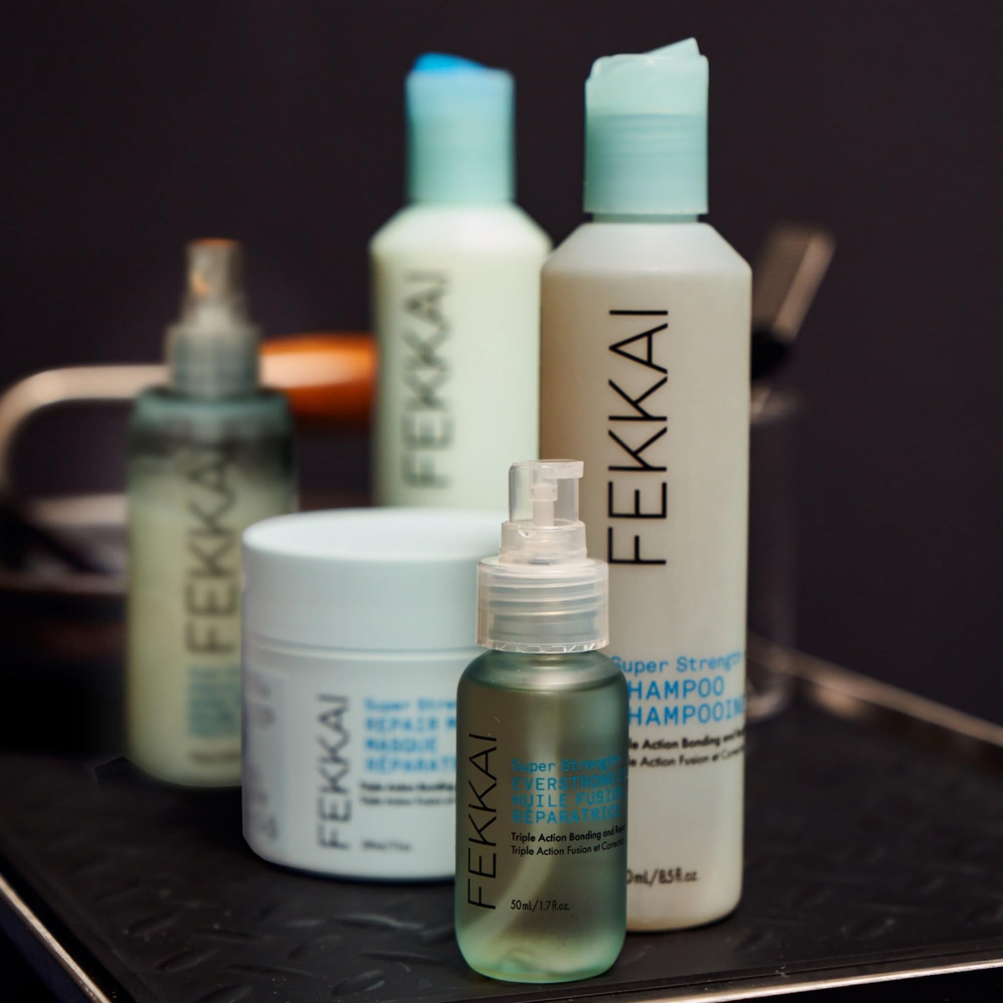 Fekkai PowerBond Mist applied to hair demonstrates hydrating repair in action.