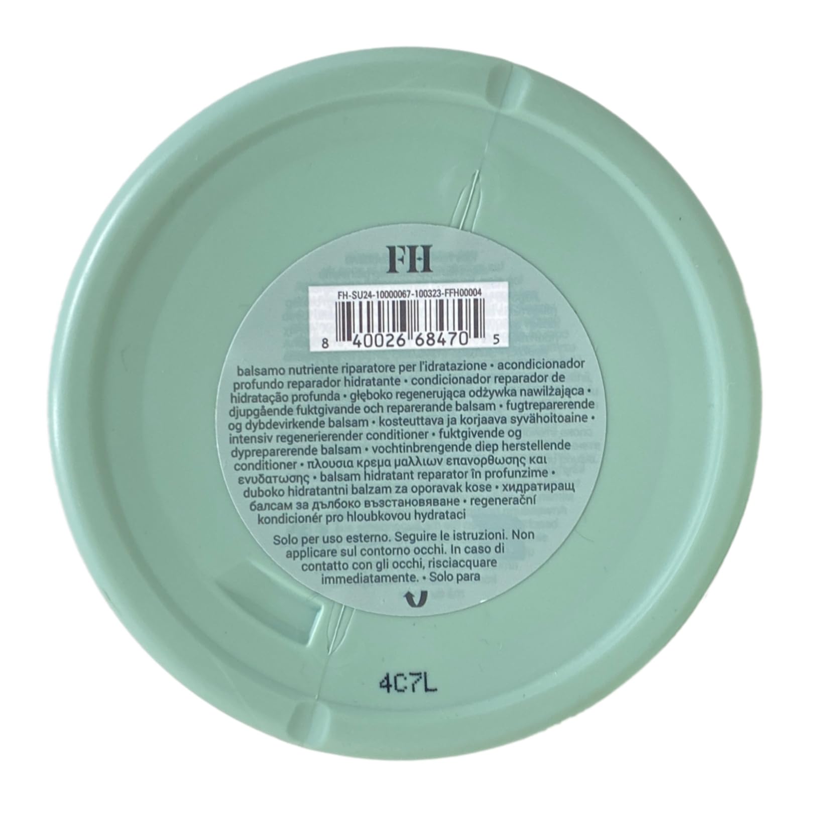 Fenty Hair Richer One label close-up highlights luxe amber floral fragrance