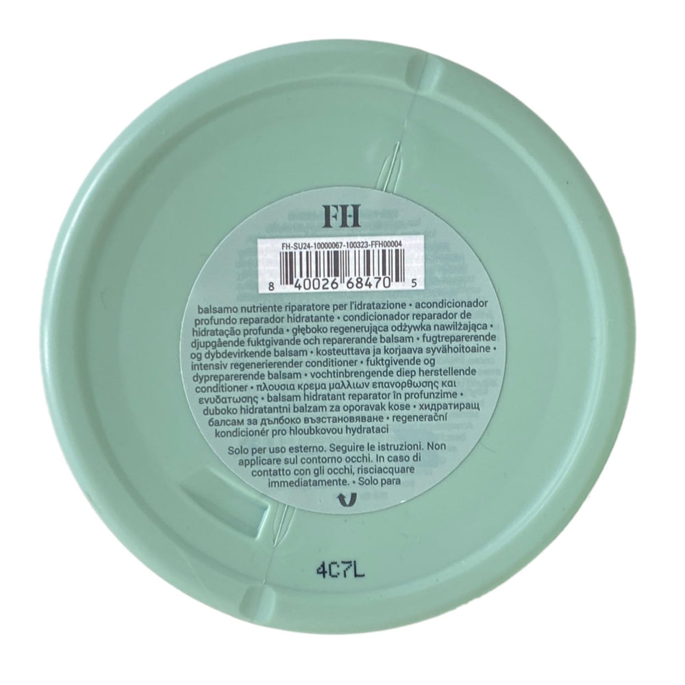 Fenty Hair Richer One label close-up highlights luxe amber floral fragrance