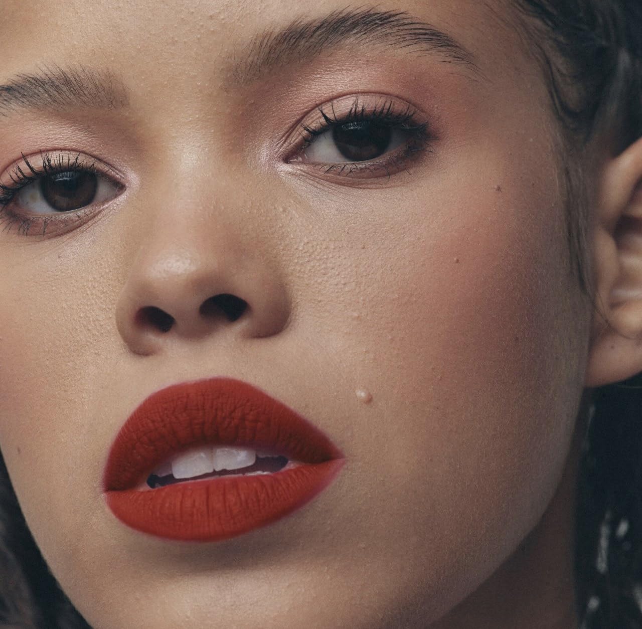 Fenty Icon Velvet Lipstick H.B.I.C. swatch on arm displaying high-coverage color