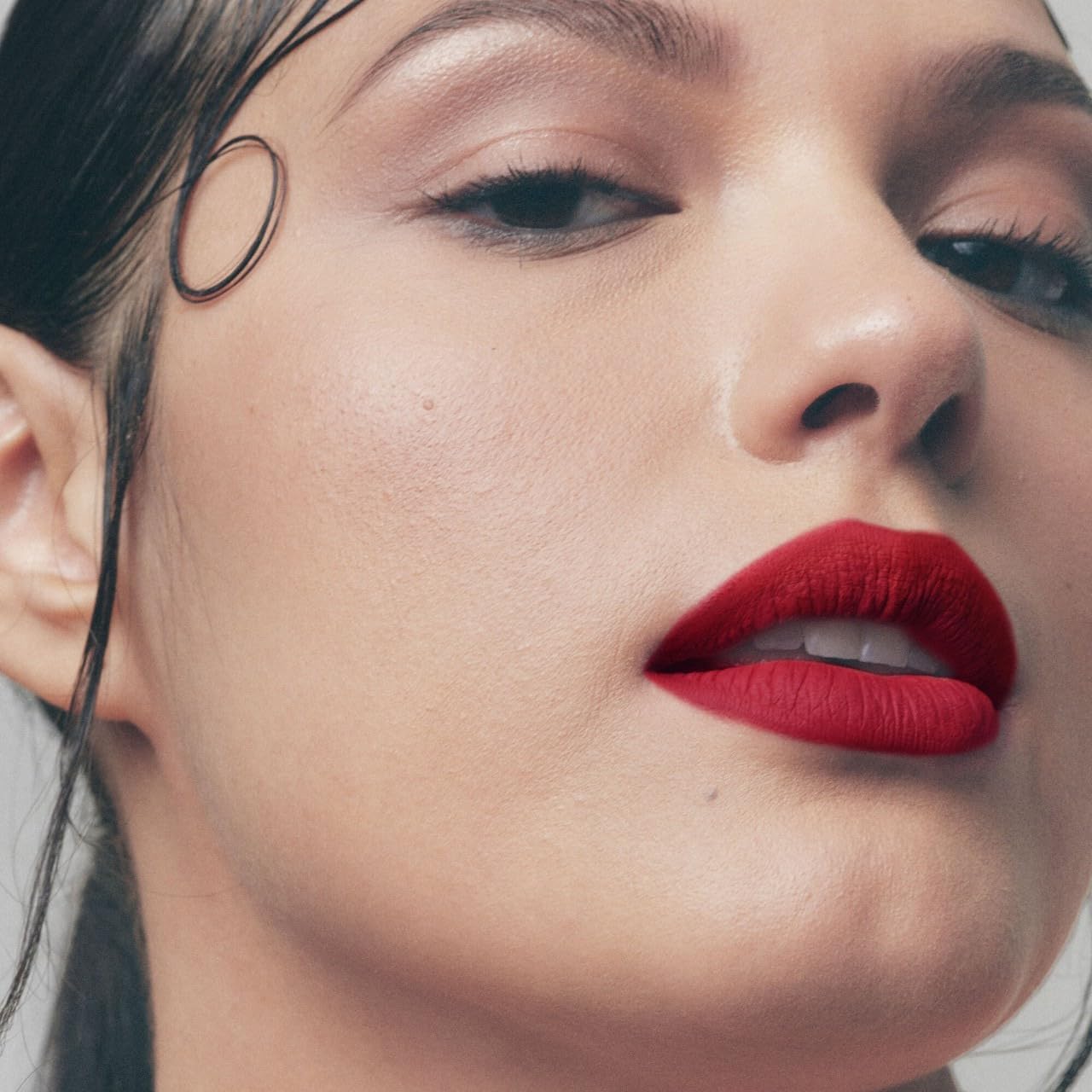 Fenty Icon Velvet Lipstick swiped on lips shows comfortable wear throughout day.