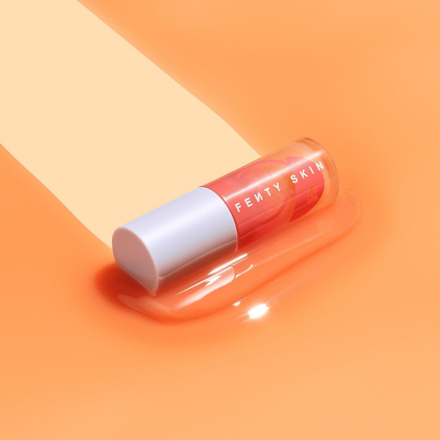 Fenty Treatz Lip Oil plush doe-foot applicator glides smoothly